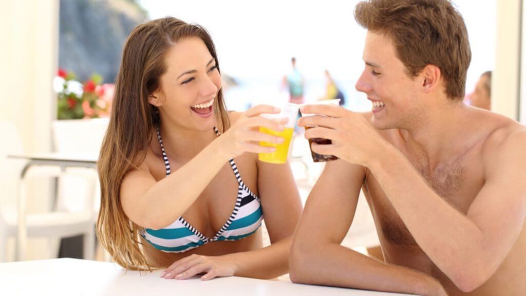 man and woman having a drink